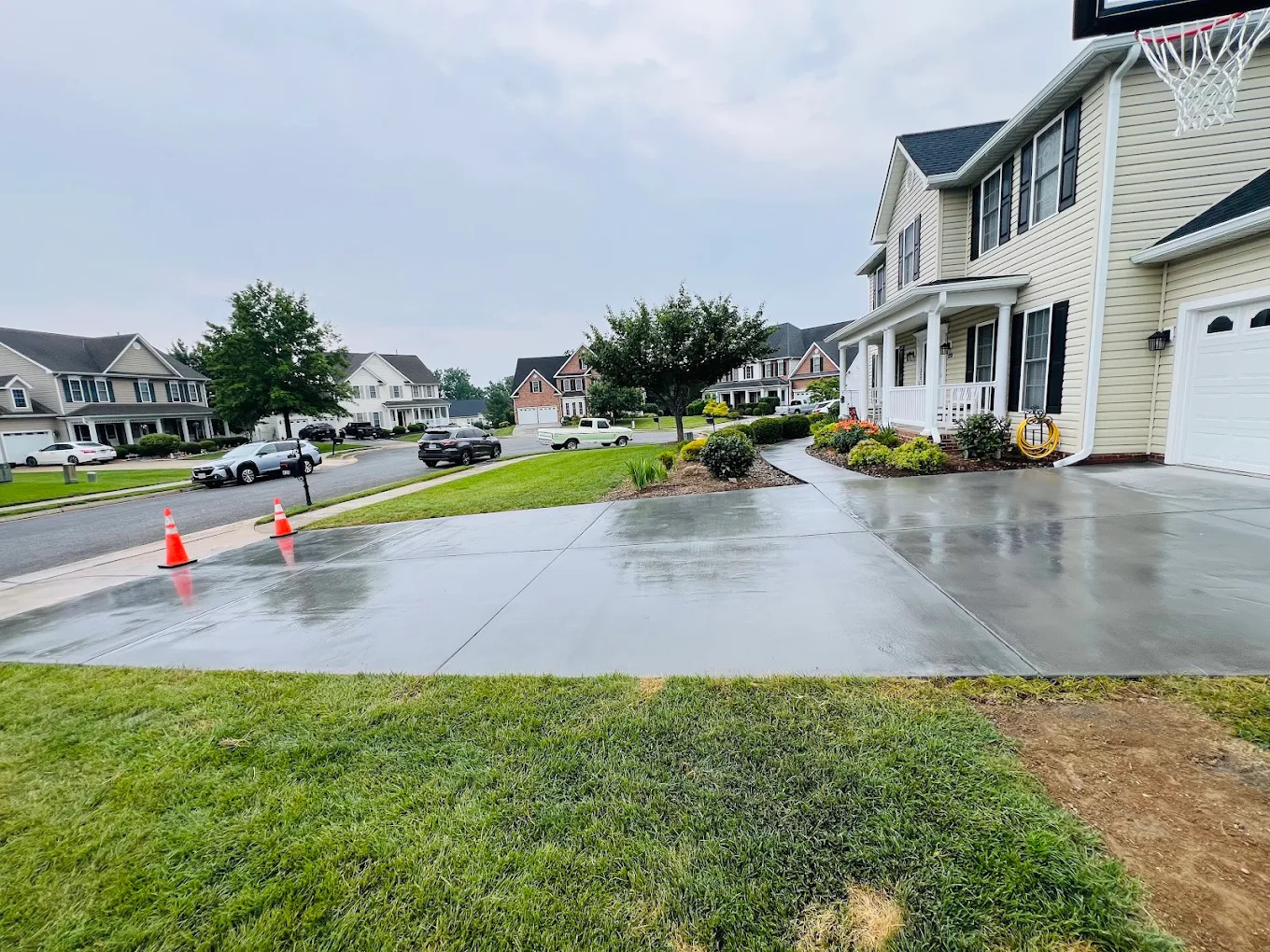 Cleaned concrete driveway after exterior cleaning