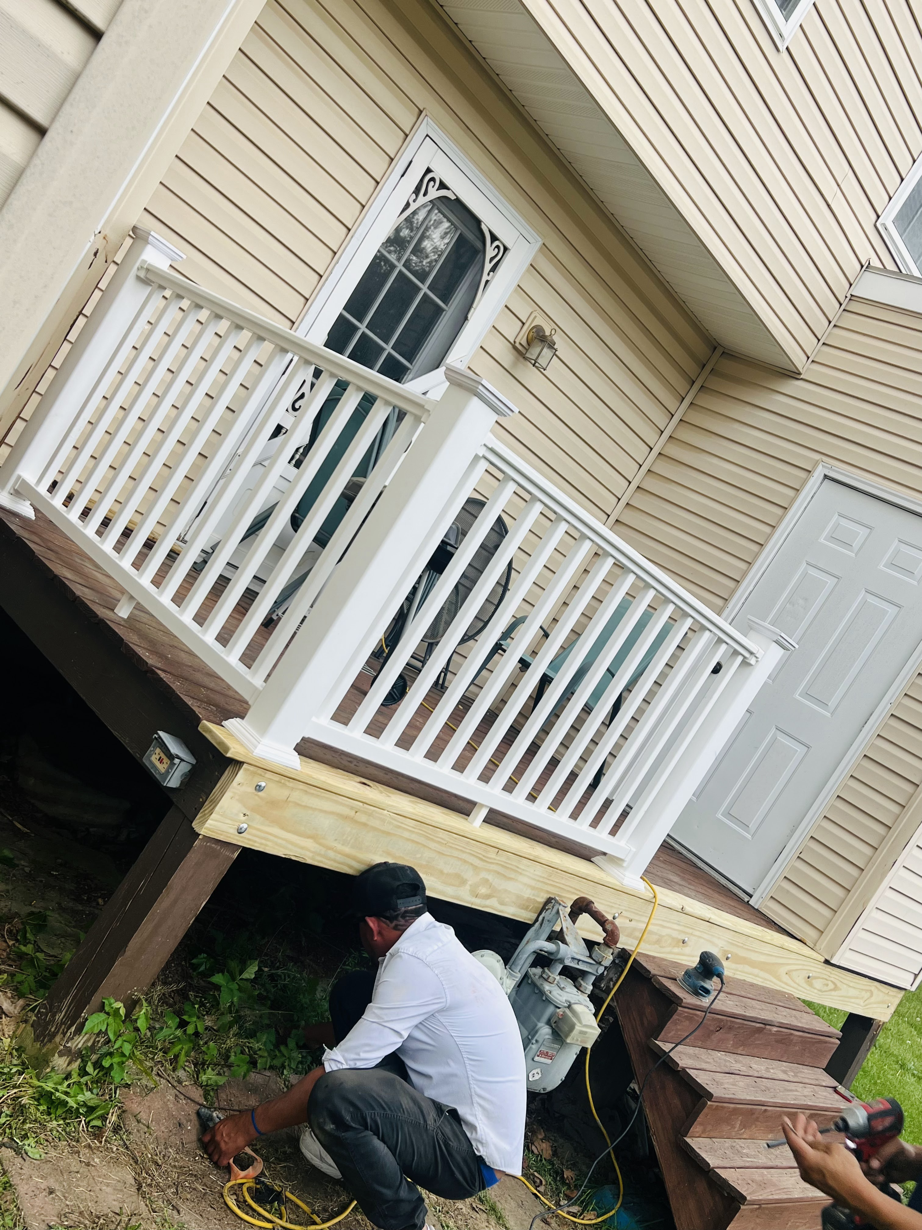 Deck stairs and railing repair in progress