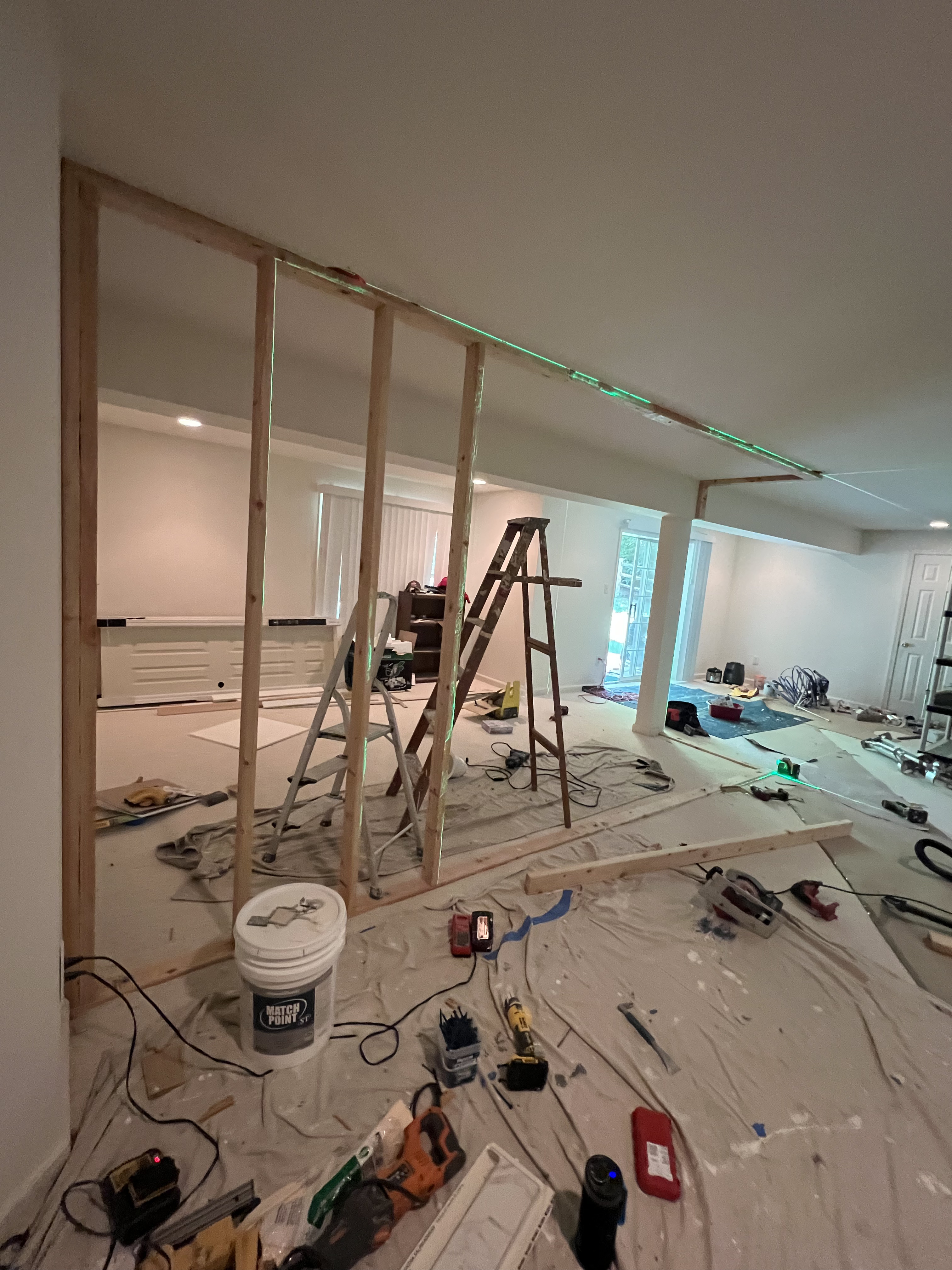 Interior remodeling with framing and drywall work in progress